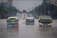 (240425) -- DAR ES SALAAM, April 25, 2024 (Xinhua) -- Photo taken on April 25, 2024 shows buses in floodwater in Dar es Salaam, Tanzania. Flash floods caused by ongoing torrential rains have left 155 dead and 236 others injured in Tanzania, Prime Minister Kassim Majaliwa told parliament on Thursday. (Xinhua\/Emmanuel Herman