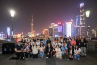 (240426) -- BEIJING, April 26, 2024 (Xinhua) -- The Muscatine High School delegation poses for a group photo at the Bund area in east China\'s Shanghai, April 23, 2024. A total of 32 students and eight teachers from Muscatine High School, in the U.S. state of Iowa recently attended a week-long study tour to Beijing, Hebei and Shanghai. The Muscatine High School delegation is part a China-initiated program that will invite 50,000 American youths to China within five years for exchanges and study. The delegation is the second batch from the school. (Xinhua\/Wang Xiang
