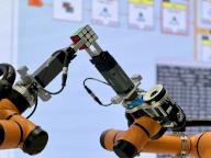 (240427) -- BEIJING, April 27, 2024 (Xinhua) -- Two robotic arms work closely together to restore a Rubik\'s Cube at the Siemens Yangtze River Delta AI Lab in Suzhou, east China\'s Jiangsu Province, April 11, 2024. (Xinhua\/Du Juanjuan