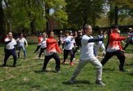 (240428) -- NEW YORK, April 28, 2024 (Xinhua) -- People perform Tai Chi during a themed event at Central Park in New York, the United States, on April 27, 2024. (Photo by Scout Chen\/Xinhua