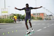 (240429) -- COTONOU, April 29, 2024 (Xinhua) -- A roller skater competes in the freestyle skating during the 62nd Challenge Cotonou Skating Open in Cotonou, Benin, on April 28, 2024. (Photo by Seraphin Zounyekpe\/Xinhua