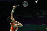(240429) -- CHENGDU, April 29, 2024 (Xinhua) -- Panitchaphon Teeraratsakul of Thailand hits a return in the singles match against Anthony Sinisuka Ginting of Indonesia during the group C match between Indonesia and Thailand at BWF Thomas Cup Finals in Chengdu, southwest China\'s Sichuan Province, April 28, 2024. (Xinhua\/Chen Bin
