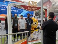 (240501) -- GUANGZHOU, May 1, 2024 (Xinhua) -- Foreign merchants pose for a photo with a mascot outside the venue of the third phase of the Canton Fair in Guangzhou, south China\'s Guangdong Province, May 1, 2024. The five-day third phase of the fair started on Wednesday, with the participation of 11,000 enterprises. (Xinhua\/Hong Zehua