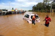 (240503) -- BEIJING, May 3, 2024 (Xinhua) -- People pull a car submerged in flood water in Nairobi, capital of Kenya, May 1, 2024. At least 188 people have been killed by flooding and landslides caused by heavy rains in Kenya, the government said on Thursday. (Photo by Joy Nabukewa\/Xinhua