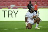 (240504) -- SINGAPORE, May 4, 2024 (Xinhua) -- United States\' player Kevon Williams scores a try during the men\'s Pool C match against Ireland at the HSBC Rugby Sevens tournament held in Singapore, May 3, 2024. (Photo by Then Chih Wey\/Xinhua