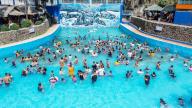(240505) -- BULACAN PROVINCE, May 5, 2024 (Xinhua) -- An aerial drone photo taken on May 5, 2024 shows people cooling off in a swimming pool at a resort in Bulacan Province, the Philippines. People spend time at pools to cool off amid heatwave in the Philippines. (Xinhua\/Rouelle Umali