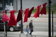 (240506) -- NEW WESTMINISTER, May 6, 2024 (Xinhua) -- Red dresses are hung along a street to mark the National Day of Awareness for Missing and Murdered Indigenous Women and Girls in New Westminster, British Columbia, Canada, on May 5, 2024. May 5 is the National Day of Awareness for Missing and Murdered Indigenous Women and Girls, also known as Red Dress Day, in Canada. (Photo by Liang Sen\/Xinhua