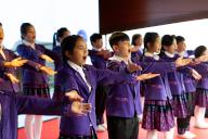 (240506) -- PARIS, May 6, 2024 (Xinhua) -- A choir consisting of children of Li and Miao ethnic groups from south China\'s Hainan Province performs during a Sino-French gastronomy festival aboard a boat along the Seine, in Paris, France, May 4, 2024. TO GO WITH "Feature: Gastronomy festival on Seine marks 60th anniversary of China-France ties" (Xinhua\/Meng Dingbo