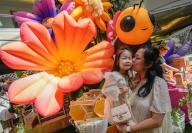 (240510) -- BURNABY, May 10, 2024 (Xinhua) -- A mother gives a kiss to her child during a Mother\'s Day celebration event at the Metropolis shopping mall in Burnaby, British Columbia, Canada, on May 9, 2024. The Mother\'s Day falls on May 12 this year. (Photo by Liang Sen\/Xinhua