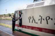 (240511) -- ADDIS ABABA, May 11, 2024 (Xinhua) -- A local train driver receivs a notebook from his Chinese predecessor at the Adama station in Adama City, Ethiopia, Sept. 9, 2023. The Chinese management contractors of Ethiopia-Djibouti standard gauge railway on Friday officially handed over the railway