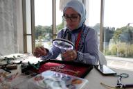 (240512) -- ALGIERS, May 12, 2024 (Xinhua) -- A woman showcases her jewelry-making skills during the national festival of women