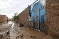 (240512) -- BAGHLAN, May 12, 2024 (Xinhua) -- A man stands in front of the gate of his house following floods in Shahrak Muhajireen village, Baghlan-e-Marzaki District, north Afghanistan