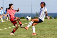 (240512) -- BALI, May 12, 2024 (Xinhua) -- Ryoo Jihae (L) of South Korea vies with Nina Mathelus of the Philippines during the Group A match of the AFC U-17 Women