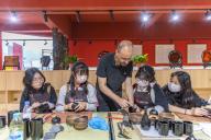 (240512) -- CHONGQING, May 12, 2024 (Xinhua) -- French artist Vincent Cazeneuve teaches students lacquer art at a vocational education center in Chengkou County, southwest China