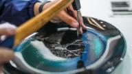 (240512) -- GUIYANG, May 12, 2024 (Xinhua) -- Chen Yinfu makes an artwork of Dafeng porcelain carving during a national vocational skills competition held in Guiyang, southwest China