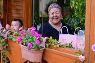 (240513) -- YINING, May 13, 2024 (Xinhua) -- Tourists enjoy themselves on Liuxing Street in Yining City, Ili Kazak Autonomous Prefecture, northwest China