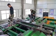 (240515) -- URUMQI, May 15, 2024 (Xinhua) -- Workers refit agricultural machines at a workshop of Han Bo in Shawan City, northwest China