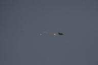 (240515) -- ISRAEL-GAZA BORDER, May 15, 2024 (Xinhua) -- An Israeli Air Force fighter plane flies over the Gaza Strip seen from Israel