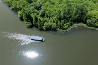 (240516) -- ZHUJI, May 16, 2024 (Xinhua) -- An aerial drone photo taken on May 16, 2024 shows a tourist boat at the Baita Lake national wetland park in Zhuji City, east China