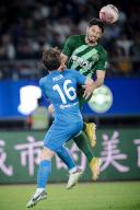 (240517) -- HANGZHOU, May 17, 2024 (Xinhua) -- Lucas Possignolo (R) of Zhejiang FC vies with David Puclin of Nantong Zhiyun during the 2024 season Chinese Football Association Super League (CSL) 12th round match between Zhejiang FC and Nantong Zhiyun in Hangzhou, east China