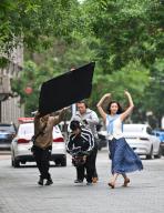 (240518) -- TIANJIN, May 18, 2024 (Xinhua) -- A short video production team shoots on Jiefang North Road in north China