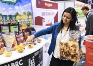 (240520) -- CHICAGO, May 20, 2024 (Xinhua) -- A representative restocks some samples during the 2024 National Restaurant Association Show at McCormick Place in Chicago, U.S. state of Illinois, on May 19, 2024. More than 2,240 exhibitors participated in the show. (Photo by Joel Lerner/Xinhua