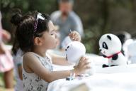 (240520) -- MEXICO CITY, May 20, 2024 (Xinhua) -- A child paints a stuffed panda toy during a cultural salon in Mexico City, Mexico, on May 19, 2024. (Photo by Francisco Canedo/Xinhua