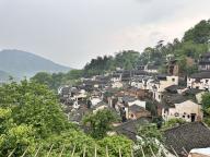 (240521) -- BEIJING, May 21, 2024 (Xinhua) -- This photo taken on April 16, 2024 shows residential houses and rustic homestays in Huangling Village of Wuyuan, east China