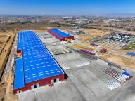 (240521) -- BAOTOU, May 21, 2024 (Xinhua) -- An aerial drone photo taken on May 11, 2024 shows wind turbine blades at a wind power equipment manufacturer in Baotou, north China