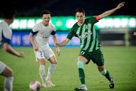 (240521) -- HANGZHOU, May 21, 2024 (Xinhua) -- Franko Andrijasevic (R) of Zhejiang FC competes during the 13th round match between Zhejiang FC and Wuhan Three Towns FC at the 2024 Chinese Super League (CSL) in Hangzhou, east China