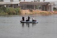 (240521) -- CAIRO, May 21, 2024 (Xinhua) -- Rescuers on a boat search in the Nile River after a minibus fell off a ferry in Giza, Egypt, May 21, 2024. A minibus fell off a ferry on the Nile River in Egypt on Tuesday, killing six people and wounding nine others. (Xinhua/Ahmed Gomaa