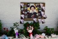 (240521) -- DAMASCUS, May 21, 2024 (Xinhua) -- Flowers are seen laid at the Iranian embassy in Syria in Damascus, Syria, to offer condolences for the victims of the helicopter crash near Varzaqan County, Iran, on May 21, 2024. Iranian President Ebrahim Raisi and some members of his accompanying team, including Foreign Minister Hossein Amir-Abdollahian, were confirmed dead Monday morning as the wreckage of the helicopter carrying them was found following its crash in bad weather on Sunday near Varzaqan County, some 670 km away from Tehran. (Photo by Ammar Safarjalani/Xinhua