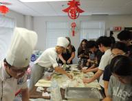 (240523) -- CHICAGO, May 23, 2024 (Xinhua) -- Students make pastries during a Chinese class held at the Chinese Consulate General in Chicago, the United States, May 21, 2024. Some 60 high school students from the Chicago Public School (CPS) district had an experience of being immersed in Chinese culture on Tuesday during a Chinese class. TO GO WITH "Feature: An amazing Chinese class for American students" (Photo by Lu Shen/Xinhua