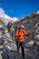 (240524) -- LHASA, May 24, 2024 (Xinhua) -- This photo taken on May 23, 2024 shows Wang Jian (front) and his team on their way to the base camp on Mount Qomolangma, in southwest China