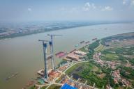 (240524) -- EZHOU, May 24, 2024 (Xinhua) -- An aerial drone photo taken on May 24, 2024 shows the construction site of the south main tower of Shuangliu Yangtze River grand bridge in Ezhou, central China
