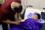 (240524) -- NABATIEH, May 24, 2024 (Xinhua) -- A child injured in an Israeli airstrike receives treatment at a hospital in the city of Nabatieh, Lebanon, May 23, 2024. A Hezbollah official was killed and three civilians were injured on Thursday in an Israeli airstrike on a civilian car on a road in southern Lebanon, Lebanese military sources said. (Photo by Ali Hashisho/Xinhua