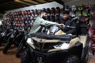 (240524) -- ISTANBUL, May 24, 2024 (Xinhua) -- Baris Acar, the owner of a motorcycle gallery, introduces a Chinese motorcycle to a customer in Istanbul, T¨¹rkiye, on May 16, 2024. TO GO WITH "Feature: Chinese motorcycles redefine riding experience in Istanbul" (Photo by Safar Rajabov/Xinhua