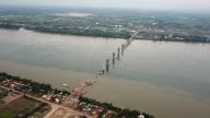 (240525) -- KRATIE, May 25, 2024 (Xinhua) -- An aerial drone photo taken on May 23, 2024 shows the construction site of the Mekong River bridge in Kratie province, Cambodia. TO GO WITH "Feature: Work on China