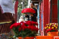 (240525) -- ADDIS ABABA, May 25, 2024 (Xinhua) -- A woman holds a bunch of flowers at a floral shop in Addis Ababa, the capital of Ethiopia, on May 24, 2024. (Xinhua/Michael Tewelde