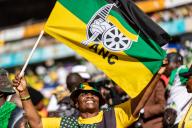 (240525) -- JOHANNESBURG, May 25, 2024 (Xinhua) -- A supporter of the African National Congress (ANC) waves a flag during the party