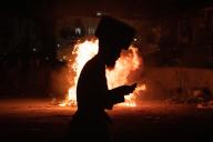 (240526) -- JERUSALEM, May 26, 2024 (Xinhua) -- An Ultra-Orthodox Jewish person attends a fire burning ceremony as they celebrate the Jewish holiday of Lag BaOmer in Jerusalem, on May 25, 2024. (Xinhua/Chen Junqing