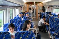 (240526) -- GUANGZHOU, May 26, 2024 (Xinhua) -- Passengers are seen on the first train of the intercity railway from Foshan to Dongguan in south China
