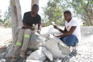(240526) -- HARARE, May 26, 2024 (Xinhua) -- Two sculptors work on a stone sculpture in Harare, Zimbabwe, May 21, 2024. TO GO WITH "Feature: Zimbabwean sculptors find voice in stone carving" (Xinhua/Tafara Mugwara