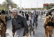 (240526) -- SANAA, May 26, 2024 (Xinhua) -- Detainees walk to attend a press conference on their release by the Houthi group in Sanaa, Yemen, May 26, 2024. Yemen