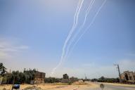 (240527) -- RAFAH, May 27, 2024 (Xinhua) -- A barrage of rockets fired from Gaza into Israel are seen in the southern Gaza Strip city of Rafah, May 26, 2024. The Al-Qassam Brigades, the armed wing of Hamas, announced on Sunday that it had launched a barrage of rockets towards Tel Aviv in central Israel, marking the first such attack in months. In a statement, the Al-Qassam Brigades said it fired the rockets in response to the Israeli killings of civilians in the Gaza Strip. (Photo by Rizek Abdeljawad/Xinhua