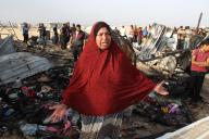 (240527) -- RAFAH, May 27, 2024 (Xinhua) -- A person reacts at the site of an Israeli strike on a camp for displaced people in Rafah in the southern Gaza Strip, May 27, 2024. At least 40 people were killed and some others injured on Sunday evening in Israel