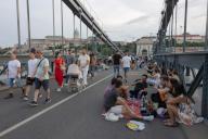 (240527) -- BUDAPEST, May 27, 2024 (Xinhua) -- People participate in the Chain Bridge picnic event in celebration of the 175th anniversary of the landmark bridge in Budapest, Hungary on May 26, 2024. (Photo by Attila Volgyi/Xinhua