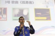 (240527) -- BUCHAREST, May 27, 2024 (Xinhua) -- A contestant demonstrates his talent during Romania Finals of the 23rd "Chinese Bridge" Chinese proficiency competition for non-Chinese college students, in Bucharest, Romania, May 26, 2024. The "Chinese Bridge" Chinese proficiency competition, an annual competition for non-Chinese college students, was held at the University of Bucharest here on Sunday. Eighteen contestants from Romanian universities competed under the theme "One World, One Family," showcasing their love and understanding of the Chinese language and culture through speeches, Q&A and talent shows. (Photo by Cristian Cristel/Xinhua