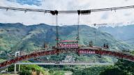 (240528) -- LIUPANSHUI, May 28, 2024 (Xinhua) -- An aerial drone photo taken on May 26, 2024 shows the construction site of Wumengshan grand bridge on Nayong-Qinglong Expressway in southwest China