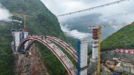 (240528) -- LIUPANSHUI, May 28, 2024 (Xinhua) -- An aerial drone photo taken on May 28, 2024 shows the construction site of Wumengshan grand bridge on Nayong-Qinglong Expressway in southwest China